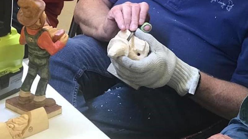 Woodcarver teaching picture