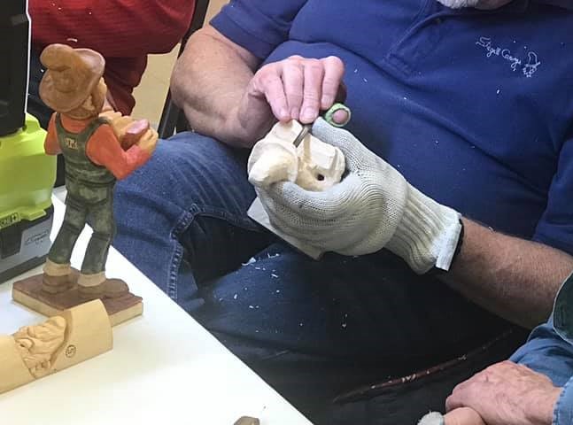 Woodcarver teaching picture